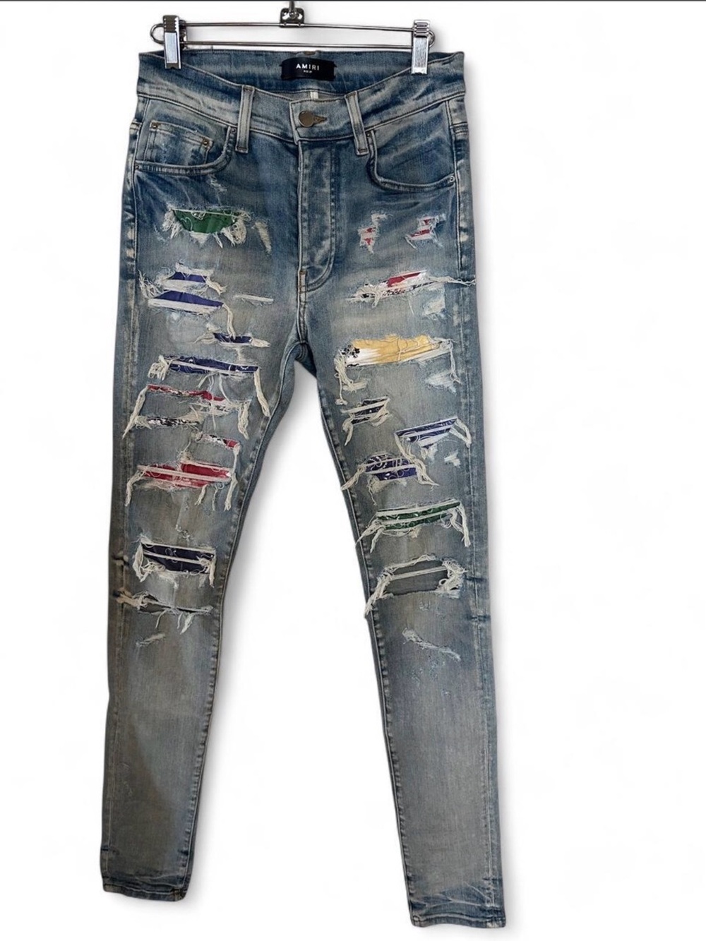 AMIRI Skinny Distressed Light Blue Jeans with Multi-Color Patch Details